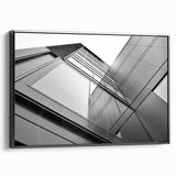Black and white wall art featuring a vintage poster art style skyscraper landscape on framed canvas, ideal for bedroom decor.