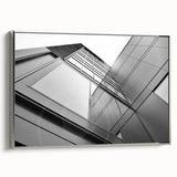 Vintage poster art of a skyscraper, framed canvas in silver, featuring black and colorful art, ideal for living room decor.