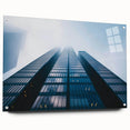 Acrylic glass print of a large abstract skyscraper design, featuring cool gray and metallic tones.