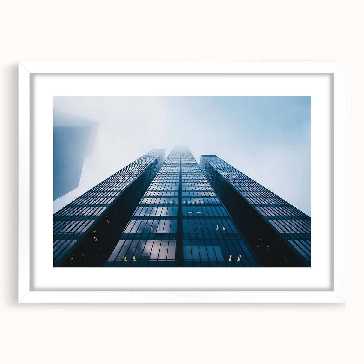 Extra large abstract art print featuring textured skyscraper designs in muted gray tones on a white framed canvas.