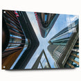 Large abstract wall art featuring a skyscraper design in muted grays and blues on acrylic glass.