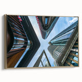 Framed canvas of a vintage skyscraper design in black with colorful accents, ideal for office decor.