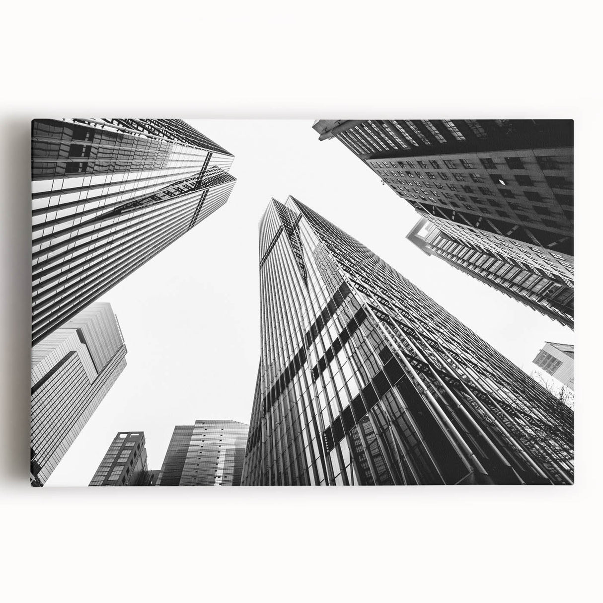 Black and white photo of a skyscraper on stretched canvas, ideal for kitchen wall art.