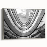 Vintage poster art of a skyscraper rendered in a black and colorful palette on extra large framed canvas.