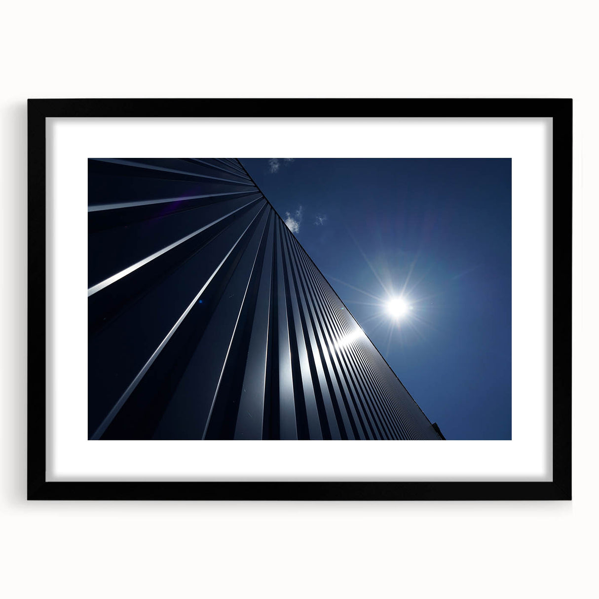Extra large abstract art print featuring a textured colorful skyscraper design on a black framed canvas.