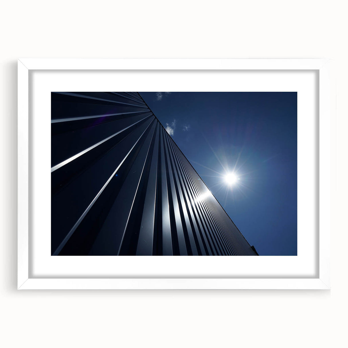 Extra large abstract art print of skyscrapers in textured gray tones on a white framed canvas, ideal for living room decor.