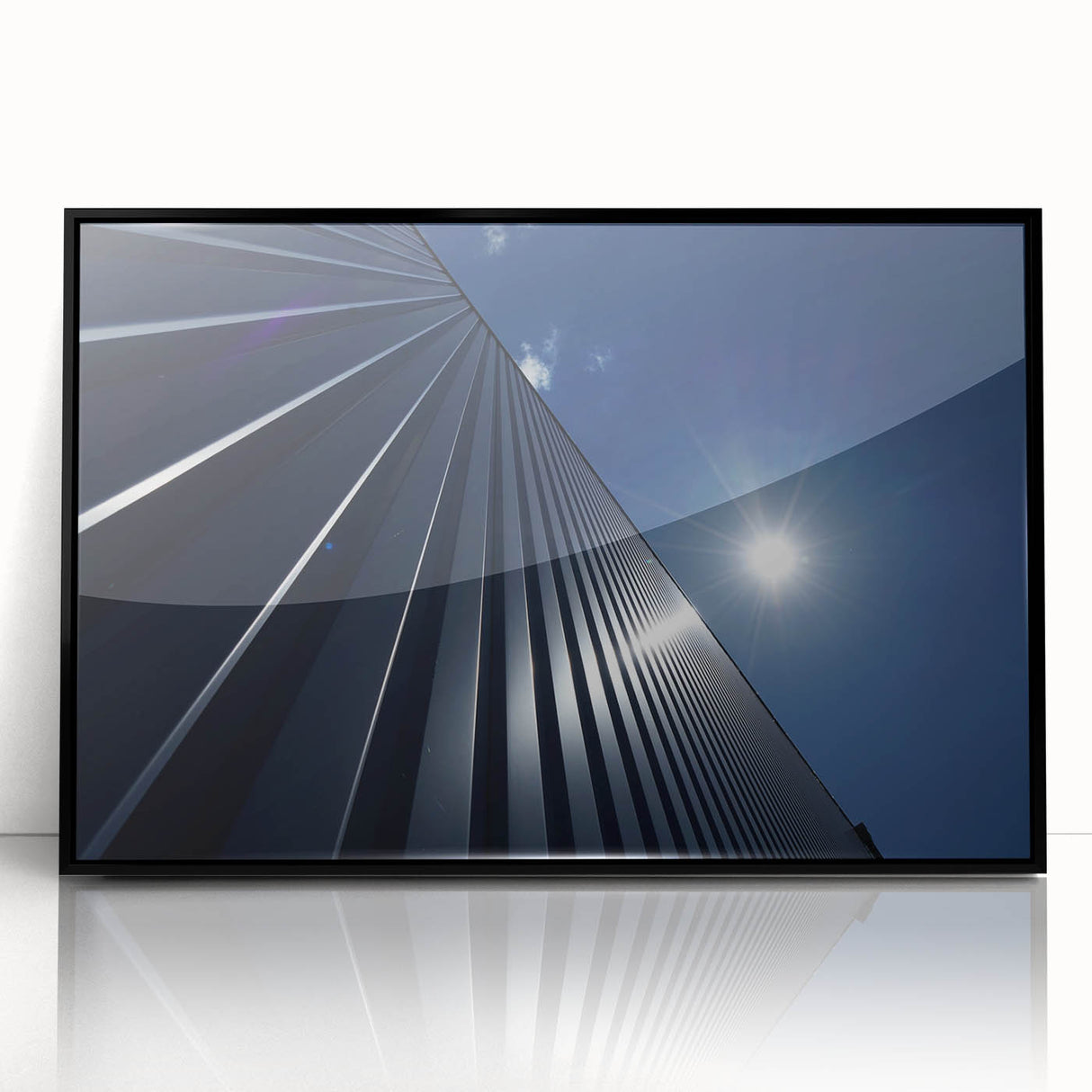 Large abstract wall art featuring a black and white skyscraper design on a framed acrylic, ideal for modern office decor.