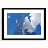 Extra large abstract art print featuring colorful, textured skyscraper designs on a black framed canvas.