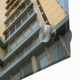 Large abstract wall art on acrylic glass featuring a mid-century modernist skyscraper design in muted gray tones.