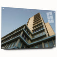 Acrylic print of a large abstract skyscraper design in muted metallic tones.