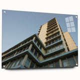 Acrylic print of a large abstract skyscraper design in muted metallic tones.