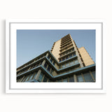 Extra large abstract art print featuring textured skyscraper designs in muted grays and whites on a framed white mat.