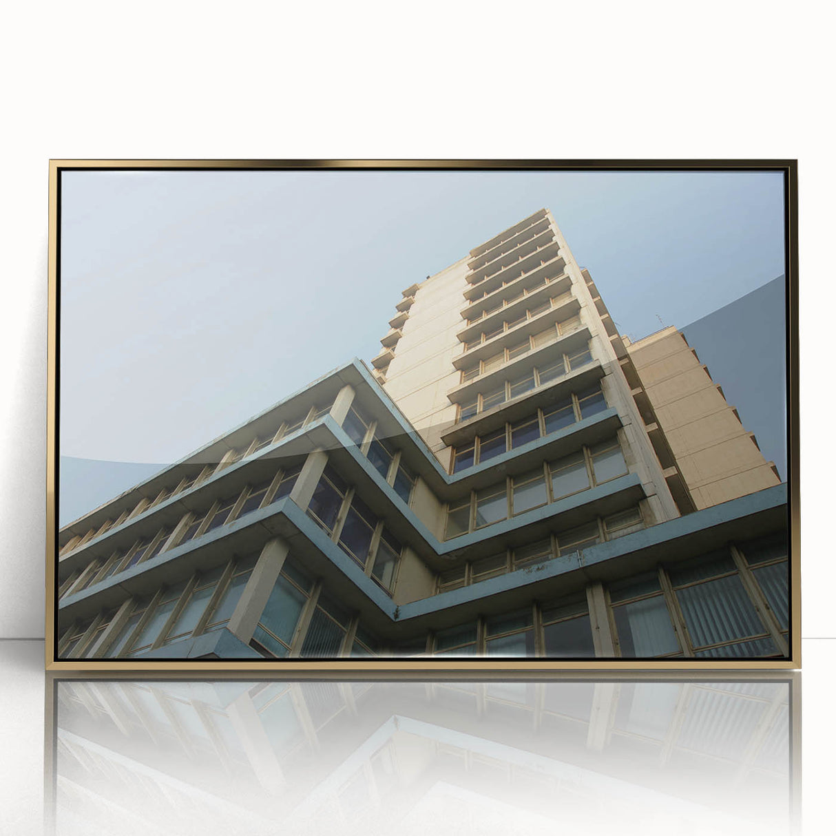 Mid-century modernist acrylic print of a skyscraper design in gold and black tones, ideal for modern art wall decor.