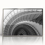 Mid-century modernist art featuring a spiral staircase in monochrome, acrylic print framed in silver.