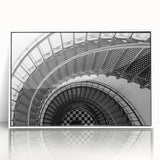 Art Deco poster featuring a spiral staircase design in black and white, framed in acrylic.