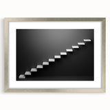 Textured abstract art print of a spiral staircase in silver frame, ideal for modern bedroom decor.