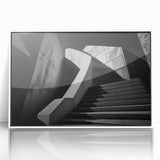 Art Deco poster featuring a geometric staircase design in black and white, framed in acrylic.