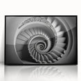 Large abstract wall art featuring a spiral staircase design in black and white, framed acrylic.