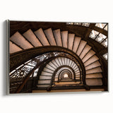 Framed canvas featuring a grayscale spiral staircase in a vintage poster art style, ideal for modern office decor.