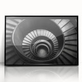 Large abstract wall art featuring a spiral staircase in black and white, framed in acrylic.