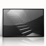 Large abstract wall art of a spiral staircase in black and white, framed acrylic, ideal for modern art wall decor.