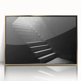 Spiral staircase design in gold and black tones on a framed acrylic, mid-century modernist style.