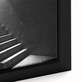 Extra large framed canvas featuring a black spiral staircase design with colorful, textured art accents.