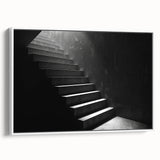 Vintage poster art of a spiral staircase in black and white on a framed canvas, ideal for living room decor.