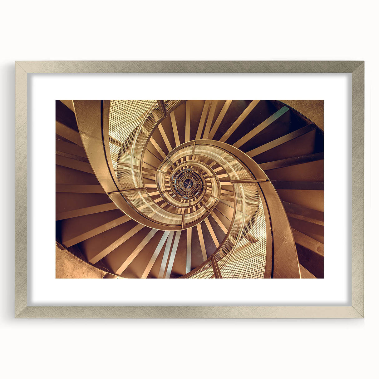 Textured abstract art print of a spiral staircase in muted gray tones on a framed silver mat, ideal for modern bedroom decor.