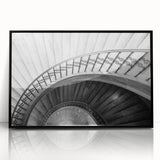 Large abstract wall art of a spiral staircase in black and white, framed acrylic, suitable for modern art wall decor.