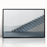 Large abstract wall art featuring a spiral staircase in black and white, acrylic print in a black frame.