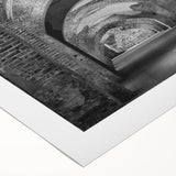 Art deco poster featuring bold geometric shapes in muted gold and black, printed on rolled canvas.