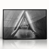 Large abstract wall art depicting geometric tunnels in black and white, framed in acrylic.