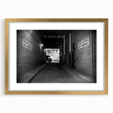 Extra large abstract art print of architectural tunnels in textured gray tones on a gold-framed canvas.