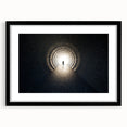 Abstract art print of geometric tunnels in black and white, framed with a black mat.