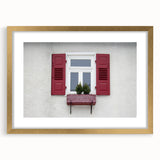 Textured art print featuring abstract window design in muted gold and white tones, framed with a gold mat.