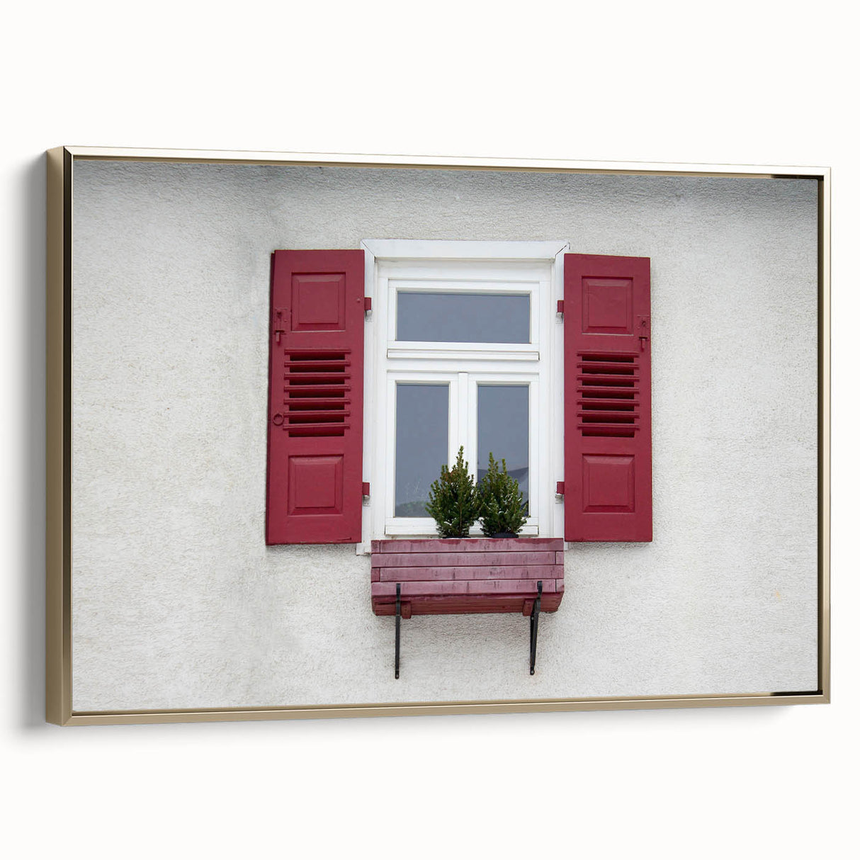 Framed canvas featuring a vintage poster of a colorful landscape with black architectural elements.