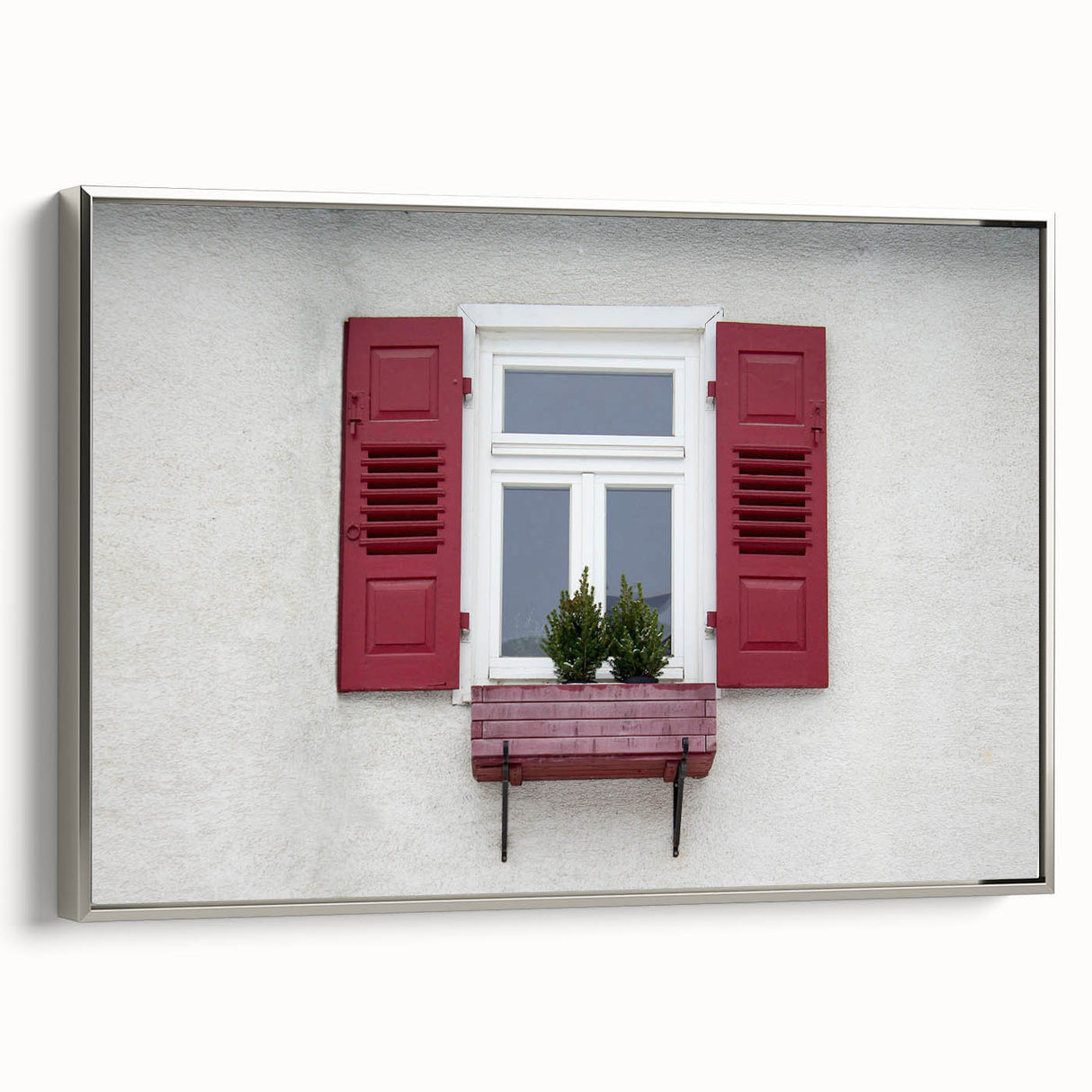 Vintage poster art of an architectural window design in a silver frame, featuring muted black and colorful art.