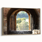 Framed canvas featuring a vintage poster of a colorful landscape painting with black wall art, set in a gold frame.