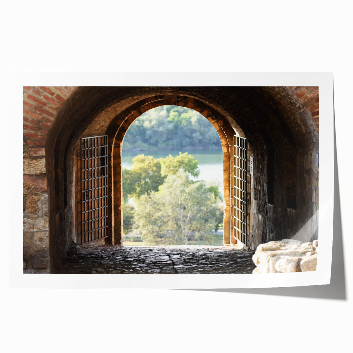 A rolled canvas print featuring a large-scale floral design in muted cream and green tones.