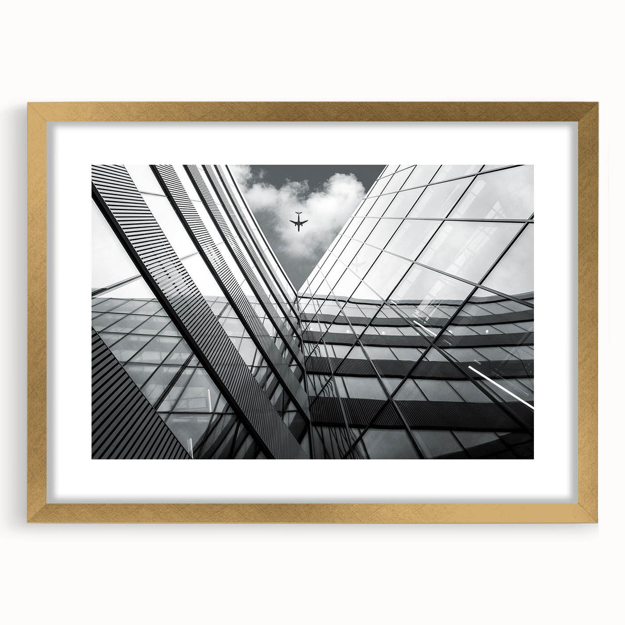 Textured abstract art print in muted gold and cream tones on a framed canvas, suitable for bedroom decor.