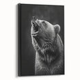 Framed wall art showcasing a striking black bear design on canvas, displayed in a stylish black frame, perfect for nature enthusiasts and home decor.
