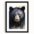 Framed wall art featuring a striking black bear design with a matte finish, showcased in a sleek black frame, perfect for nature lovers' home decor.