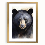 Black bear wall art design in a gold frame with matting, showcasing intricate details and a sleek front view, perfect for nature-themed decor.