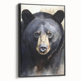 Framed canvas wall art featuring a striking black bear design, showcasing intricate details and textures, set against a sleek black frame, perfect for nature-themed decor.