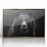 Framed wall art featuring a striking black bear design with a gold-accented frame, showcasing intricate details and vibrant colors, perfect for nature-themed decor.