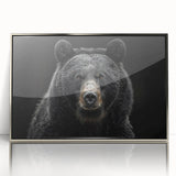 Framed wall art showcasing a striking black bear design in acrylic with a sleek silver frame, perfect for nature-themed decor. Ideal for wildlife enthusiasts.