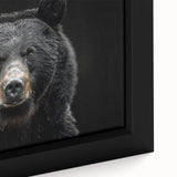 Close-up of a framed canvas wall art piece featuring a striking black bear design, showcasing intricate details and rich colors, perfect for nature lovers.