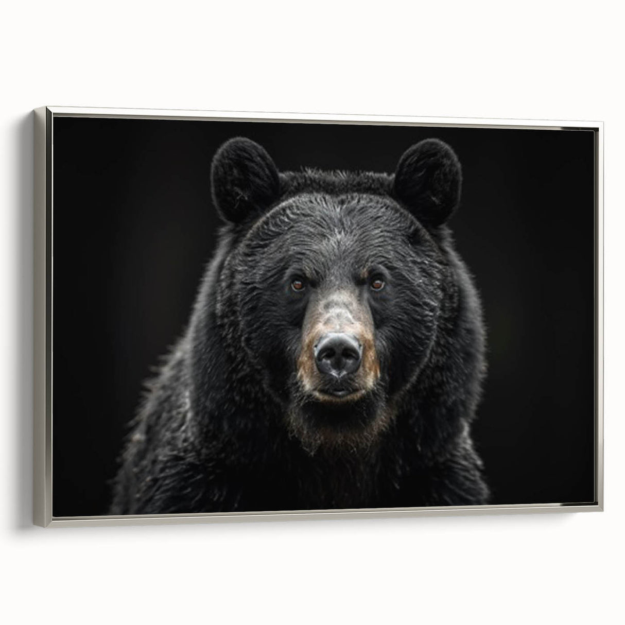 Framed canvas wall art showcasing a striking black bear design with intricate details, set against a sleek silver frame, ideal for nature-themed decor.