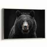 Framed canvas wall art showcasing a striking black bear design with intricate details, set against a sleek silver frame, ideal for nature-themed decor.